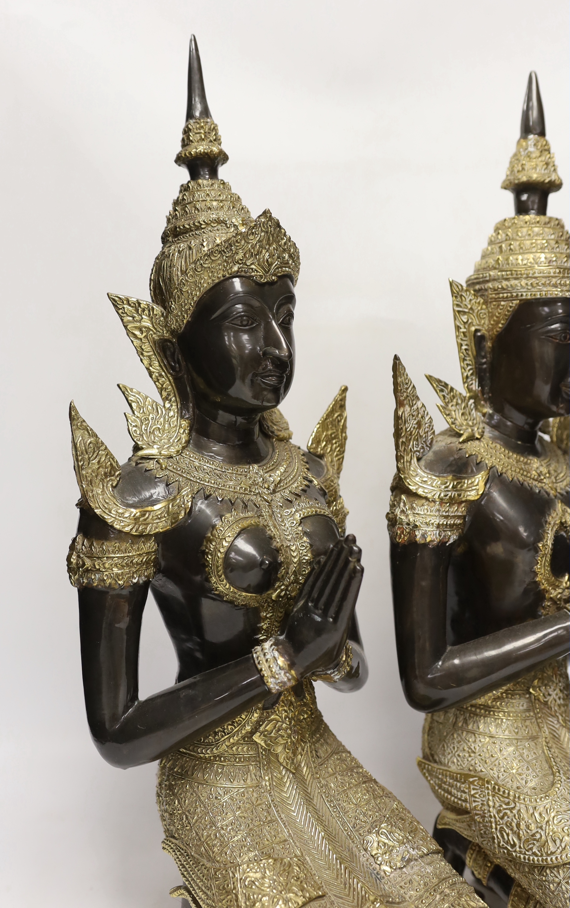 Two 20th century gilt decorated metal models of 'Thai Buddhas', 54 cm high
